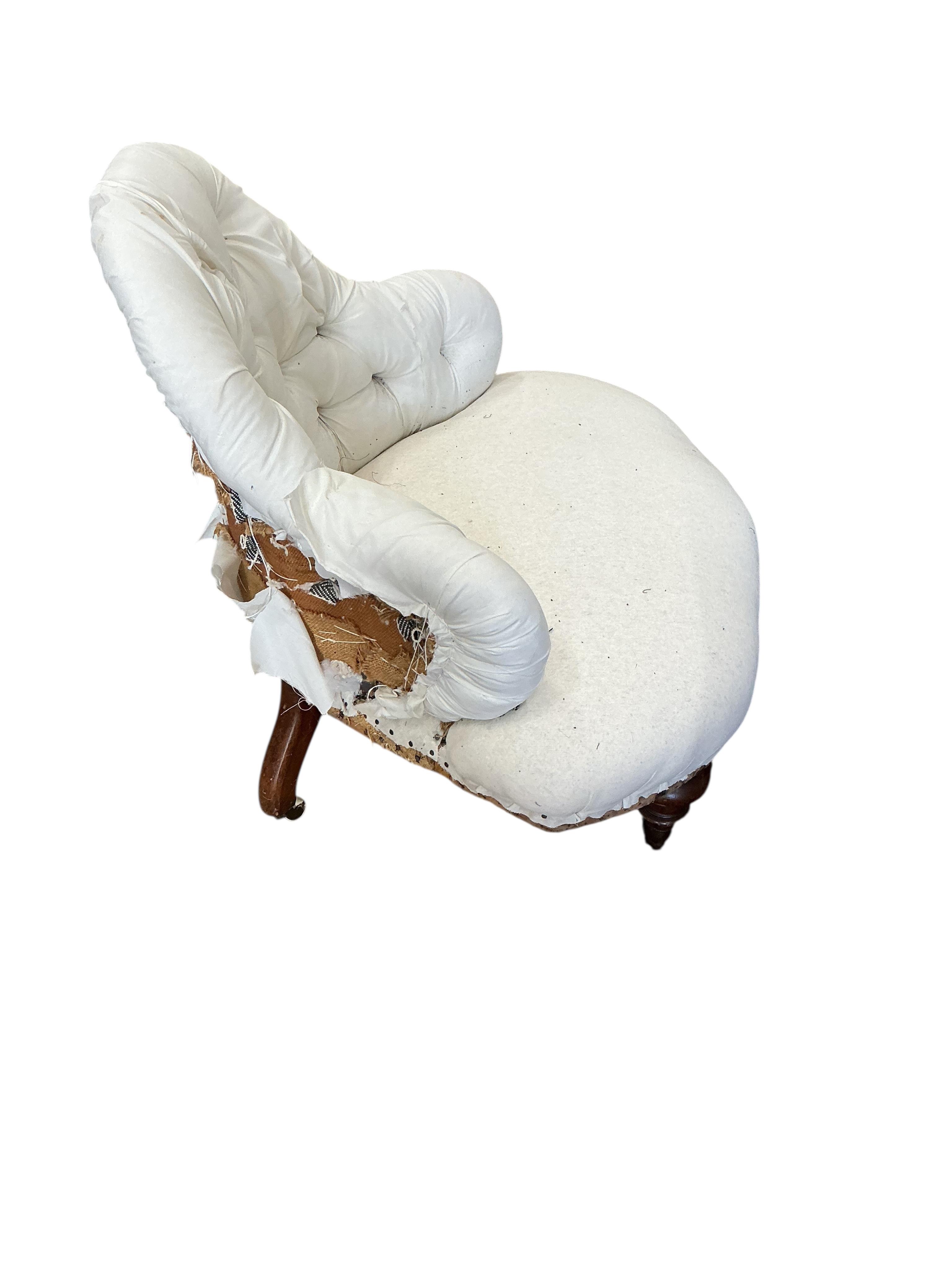 A Victorian part upholstered salon chair, width 86cm, height 78cm, in need of restoration